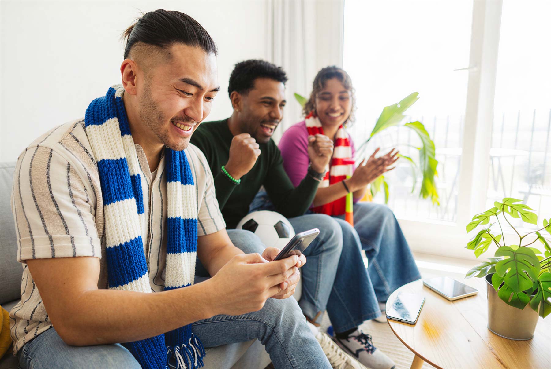 Football fans receiving SMS marketing message from their sports team