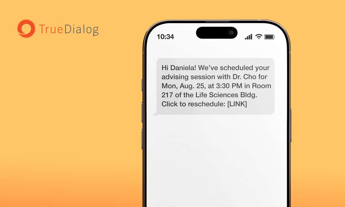 A phone with an sms appointment confirmation text reminding a user of the date and time of an appointment with a link to reschedule.