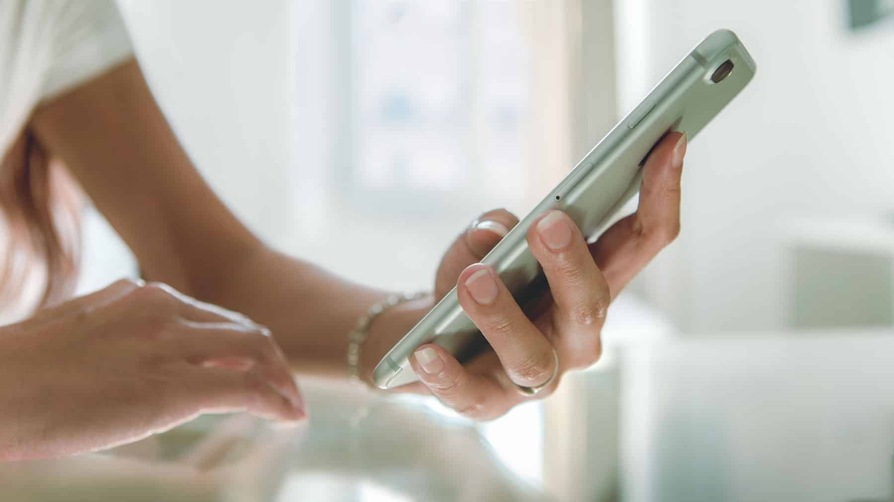 Person receiving a text message with keywords