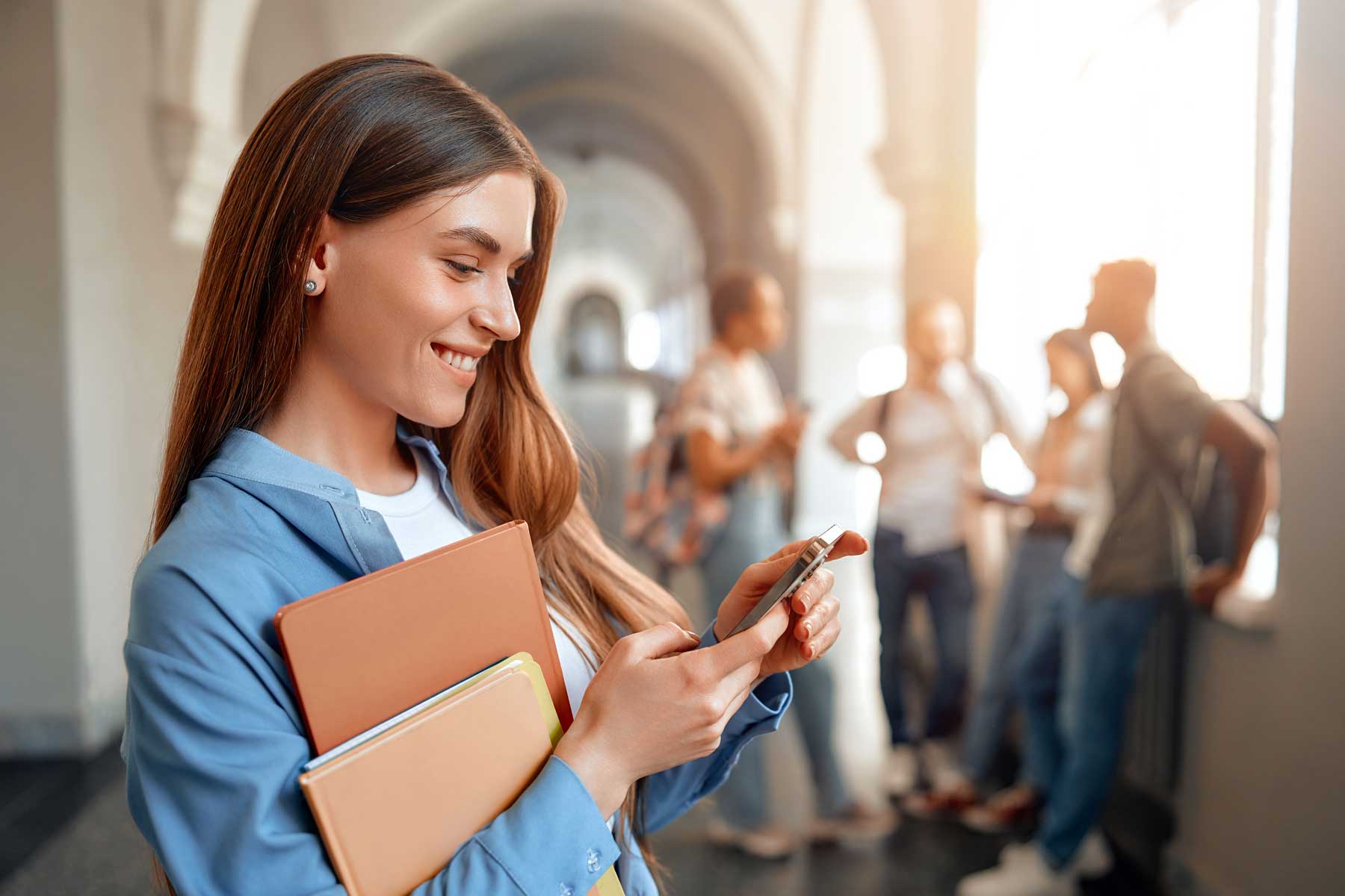 Student reading SMs message sent by her college