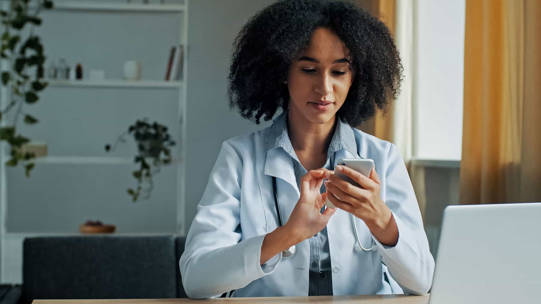 Doctor sending a HIPPA-compliant text message