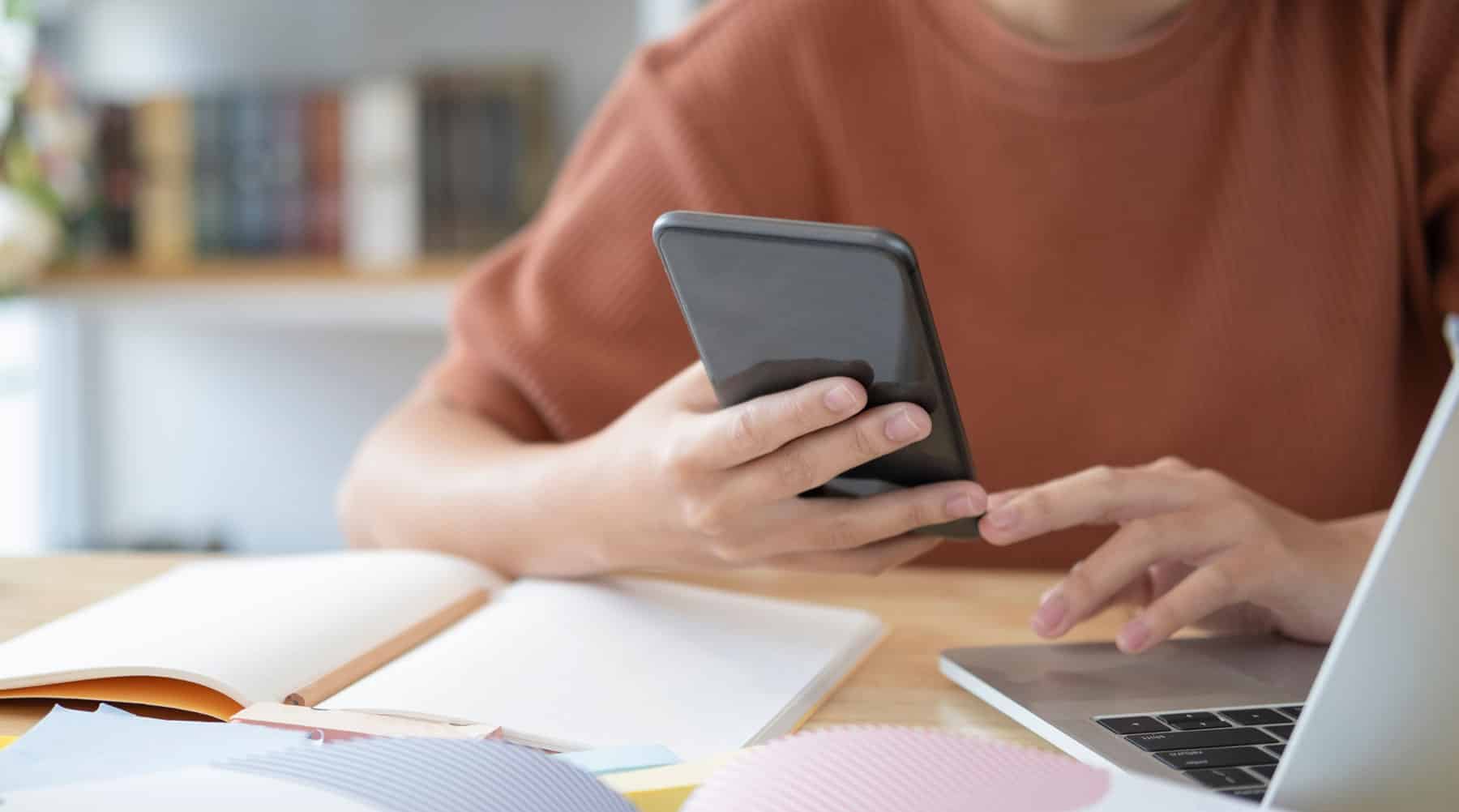 Higher education student receiving a text message