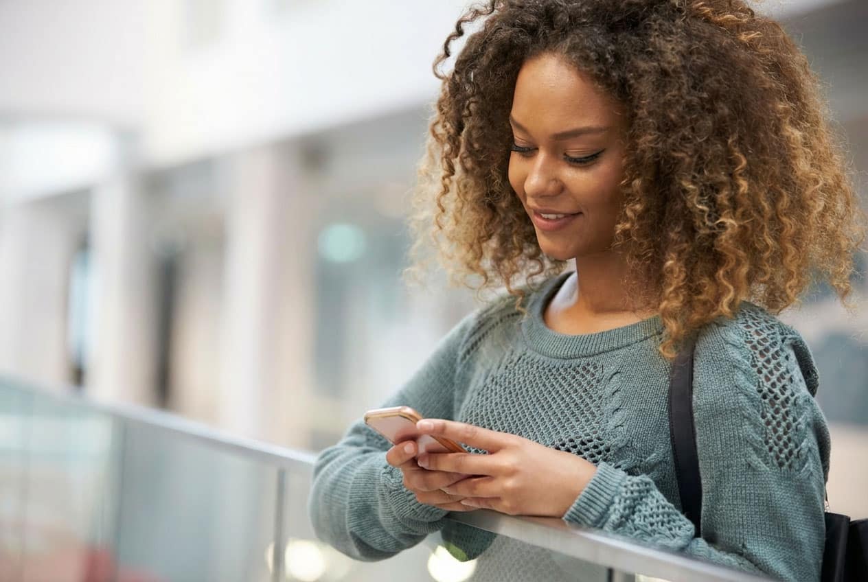 Woman reading text message on her phone