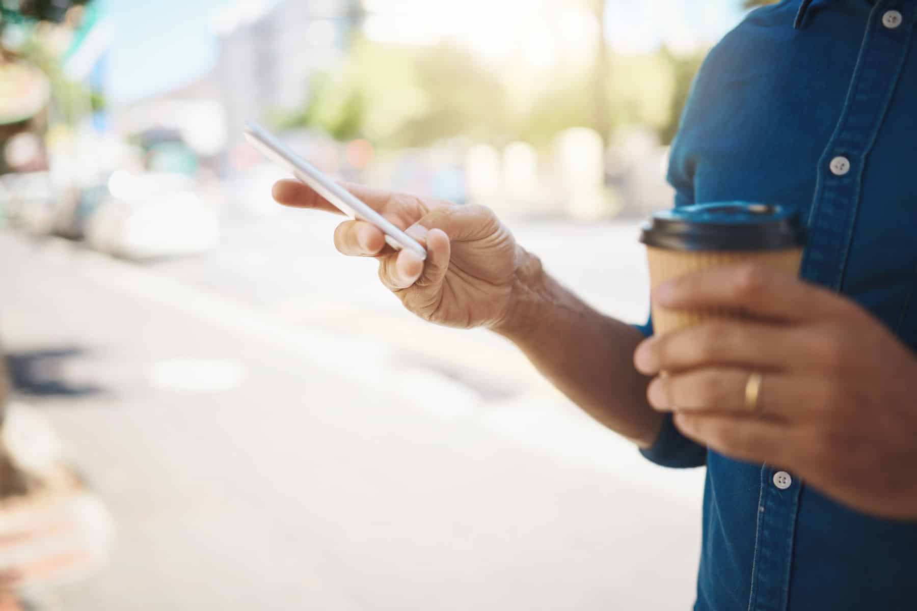 SMS delivery confirmation as man reads his text message