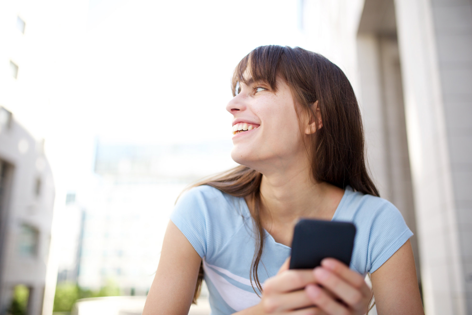 Woman receiving a text message from a call center