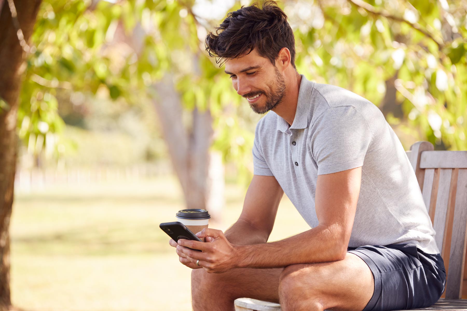 Man reading RCS compliant and secure message on his phone