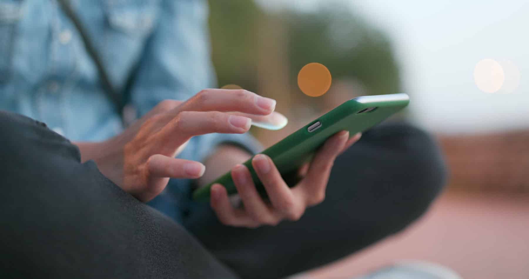 Woman receiving secure RCS message on her phone