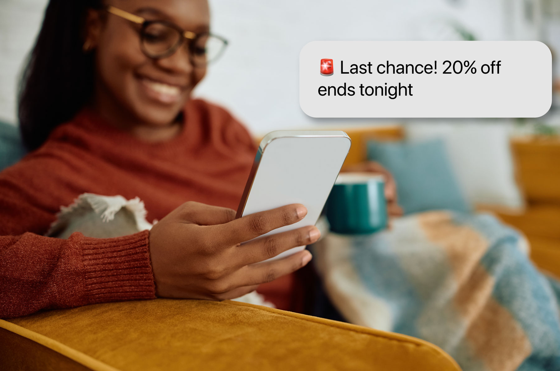 Woman receiving a text message with an emoji