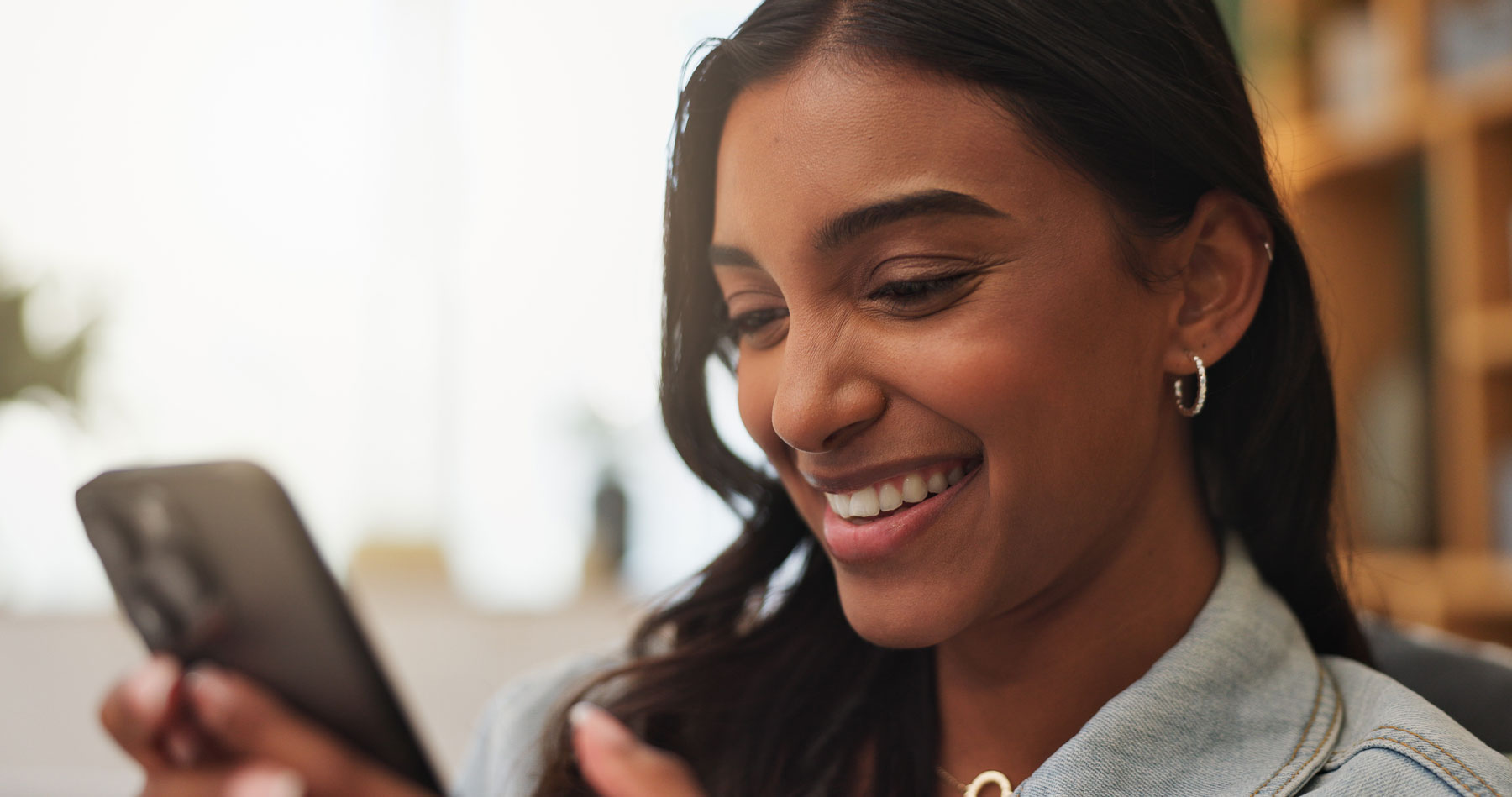 Woman reading sms message on her phone