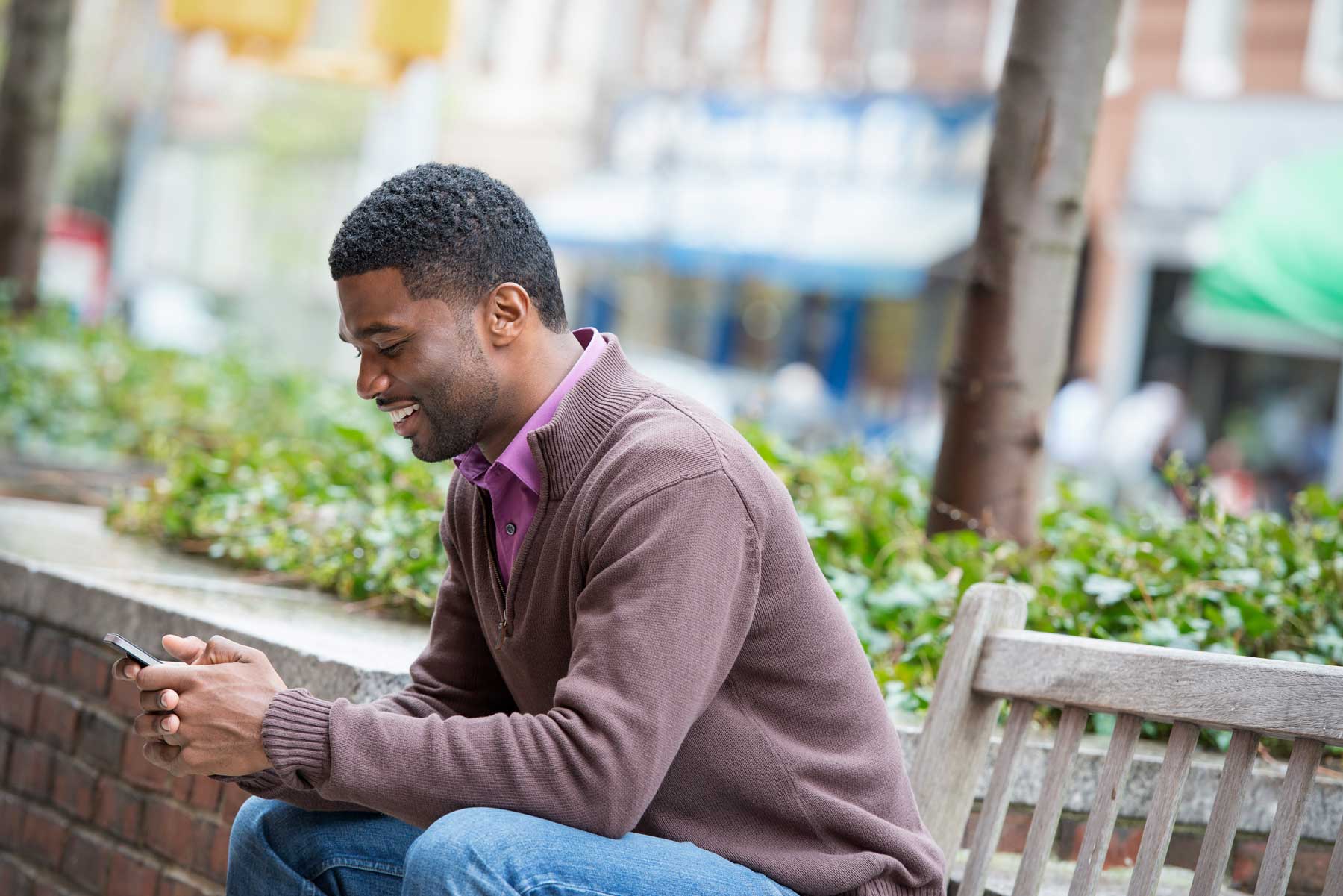 Man reading SMS message on his phone
